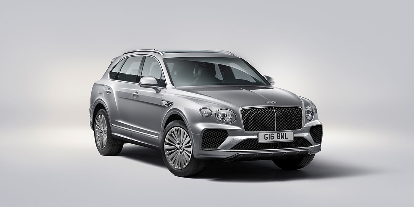 Bentley San Juan Bentley Bentayga luxury SUV front three quarter view in Moonbeam paint with matrix grille and 21″ 5 spoke painted wheels