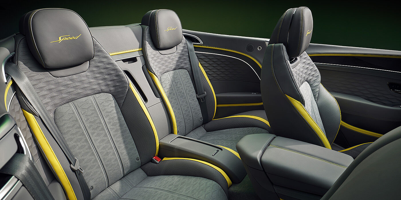 Bentley San Juan Bentley New Continental GTC Speed convertible rear interior with unique Speed colour split in Gravity Grey and Cyber Yellow hide colours, and contrast stitched headrest emblems 