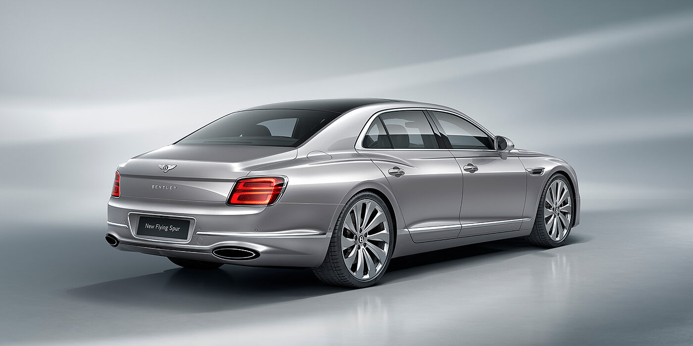 Bentley San Juan New Bentley Flying Spur sedan rear view in Silverlake paint with ten spoke wheels and chrome matrix grille
