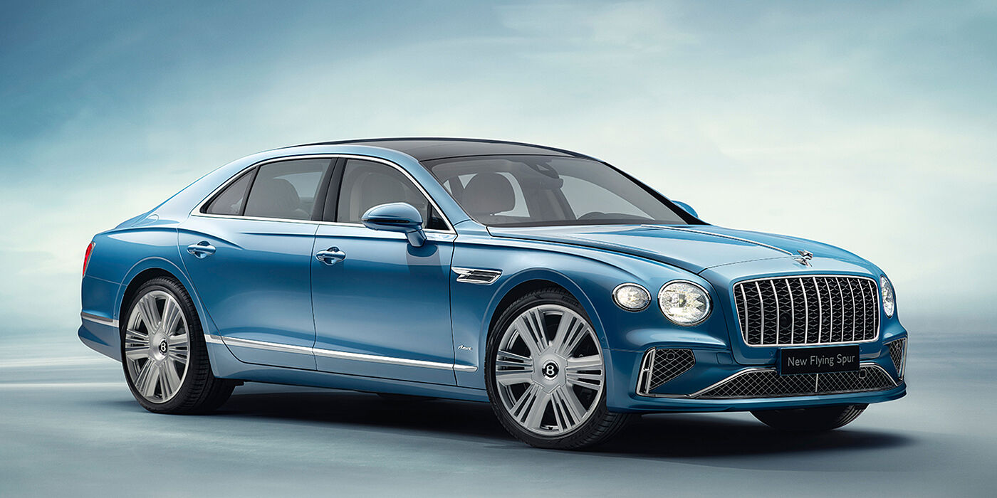 Bentley San Juan New Bentley Flying Spur Azure sedan front view in Light windsor blue by Mulliner paint with 22 inch Azure wheels and chrome exterior details